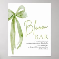 a card with the words bloom bar on it and a green ribbon tied around it