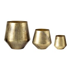 three gold vases sitting next to each other