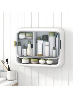 a bathroom shelf filled with lots of different items