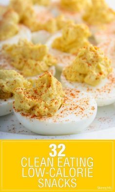 deviled eggs on a plate with the words 32 clean eating low - calorie snacks