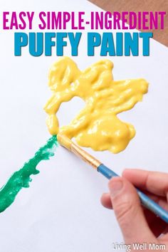 a hand holding a paintbrush and painting the words easy simple ingredient puffy paint