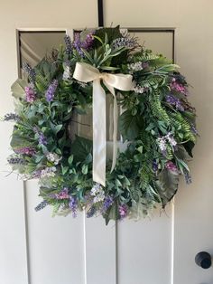 a wreath is hanging on the front door