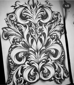 a drawing of an intricate design on paper