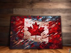 the canadian flag is painted on an old wood paneled wall in a room with hardwood flooring