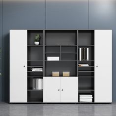 a white bookcase with two doors and some books on it in an empty room