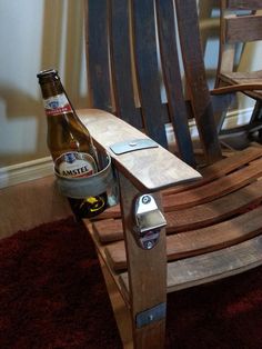 a beer bottle sitting on top of a wooden rocking chair