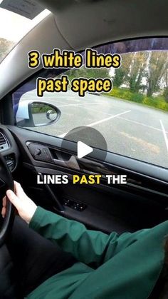 a person driving a car with the text 3 white lines past space