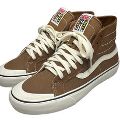 Vans Unisex Sk8 Hi 38 Decon Sf High Top Size 8.5 Nwt Tan Brown And White Canvas/Suede Ultra Cushion Insoles Rubber Toe Cap Skateboarding Shoes. These Shoes Are Brand New With Tags. It’s A Sk8-Hi Vans With Skate Features. It Has A Rubber Toe Cap. It Also Has Real Soft Removable Cushioning Insoles. It’s Made Of Suede And Canvas. It Has White Stitching All Over. An All Around Comfortable Shoe To Have In Rotation. Check My Closet For Vintage Tommy Hilfiger Columbia Sportswear The North Face Huf Bmw White Urban Skate Shoes For Outdoor, White Lace-up Skate Shoes For Outdoor, White High-top Skate Shoes For Outdoor, Brown High-top Skate Shoes With Contrast Sole, Urban Brown High-top Skate Shoes, Vans Shoes Brown, Brown High-top Synthetic Skate Shoes, Sporty Brown Vans Skate Shoes, Brown Vans