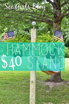 a sign with the words hammock $ 40 stand in front of a tree