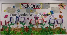 a bulletin board with flowers and pictures on it that says pick one our books are blooming