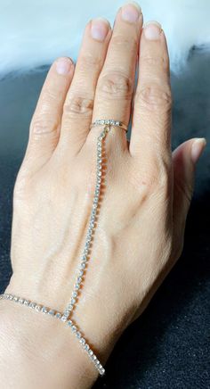 A gorgeous simple hand ornament with a simple size adjustable ring a chain and simple wrist bracelet, also size adjustable. Ring With Bracelet Attached, Bracelet With Ring Attached, Haath Phool, Hand Jewellery, Simple Jewellery, Hand Chain Bracelet, Bracelet And Ring, Bracelet Wrist, Wrist Bracelet