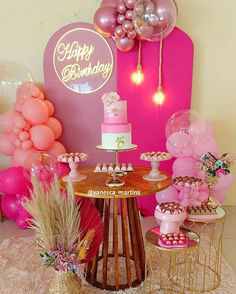 a birthday party with pink and gold decorations