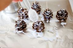 pine cones and spoons are being used to decorate them