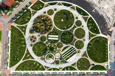 an aerial view of a circular garden in the middle of a city