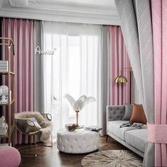 a living room filled with furniture and pink curtains