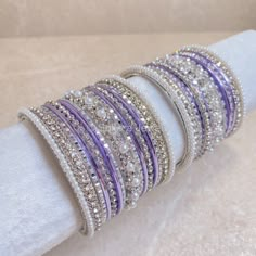 Small Silver & Purple Daisy Bangle set - SOKORA JEWELSSmall Silver & Purple Daisy Bangle setBANGLES Bangles For Saree, Purple Bangles, Pakistani Bangles, Purple Jewelry Set, Purple Jewellery, Traditional Bangles, Wedding Bangles, Indian Accessories