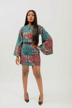 This African Print (Ankara) crop top & mini skirt set is skillfully created from light-weight cotton to offer a perfect blend of captivating charm and fragility. The top features a round neckline and long bell sleeves, while the skirt is designed with a high-waisted silhouette and back zipper. This ensemble makes it easy to enjoy a fashionable and comfortable look no matter the temperature. Set is named after the style of dance from Côte d'Ivoire; Coupé-décalé   100% Ankara wax cotton  Victoria Fitted Cotton Mini Crop Top, Fitted Cotton Two-piece Set, Chic Green Cotton Sets, Fitted Multicolor Mini Length Sets, Fitted Multicolor Mini-length Sets, Multicolor Fitted Mini Length Sets, Ankara Crop Top And Skirt, Ankara Top And Skirt, African Print Crop Top