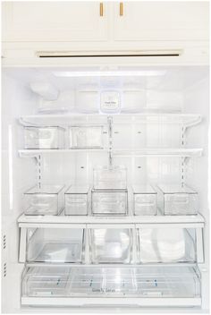 an open refrigerator with many plastic containers in it