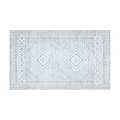 a blue and white rug with diamond shapes on the bottom, in front of a white background