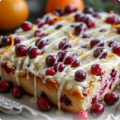 cranberry orange cake with icing on a white plate