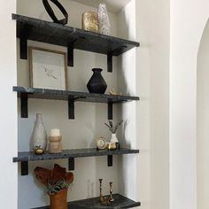 shelves with vases and other decorative items on them