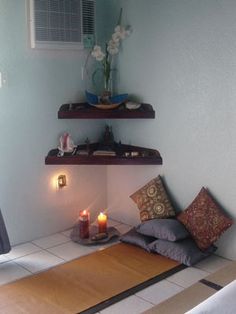 a bed room with a neatly made bed next to a window