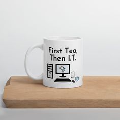 a white coffee mug with the words first coffee then i t on it sitting on top of a wooden table