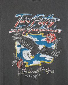 an eagle and rose on the front of a black shirt that says tour belly and the heartbirds in the gratible open