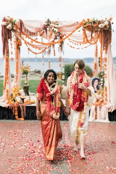 the bride and groom are walking down the aisle