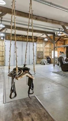 a room that has some kind of equipment hanging from it's ceiling and is empty