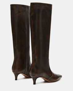 Upgrade your boot game with the LANDER boots. These boots have a square toe, knee-high length, and a trendy kitten heel and elevate any outfit while providing comfort and support. Perfect for everyday wear or dressing up for a night out. 2 inch heel height 14.75 inch shaft circumference 15.25 inch shaft height Leather Trendy Women’s Shoes, Trendy Shoes 2024, Fall Boots 2024, High Boots Aesthetic, Trendy Boots For Women, Brown Heel Boots, Tall Boots Outfit, Leather Boots Outfit, Heels Boots Outfit