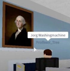 a man sitting in front of a painting with the words jorg washington machine on it