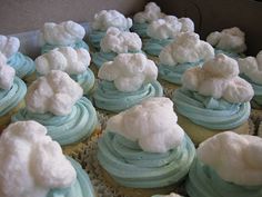 cupcakes with blue frosting and white clouds on them