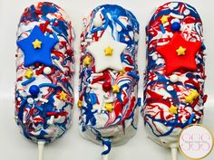 two lollipops decorated with red, white and blue sprinkles