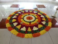 a large flower arrangement on the floor in a room