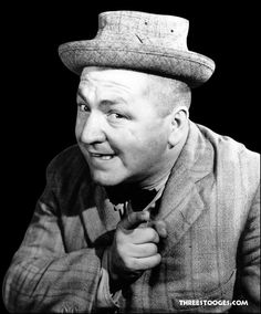 black and white photograph of a man wearing a hat