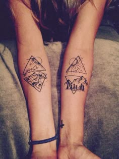 two people with matching tattoos on their arms