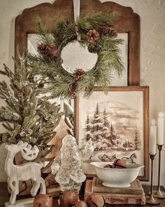 a table topped with christmas decorations and candles