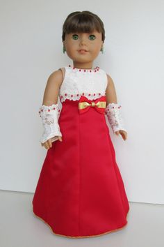 a doll wearing a red dress and white top