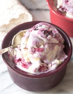 two bowls filled with ice cream on top of a table