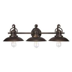 three light bathroom fixture with an antique brass finish