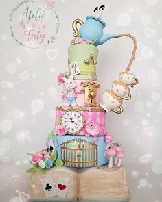 there is a cake made to look like a birdcage with many things on it