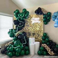 balloons and streamers are arranged in the shape of a christmas tree