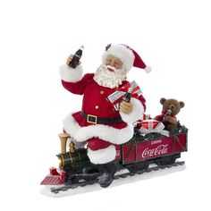 a santa clause riding on top of a toy train