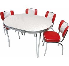 a white table with red chairs around it