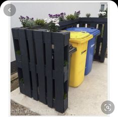 three plastic trash cans are lined up next to each other