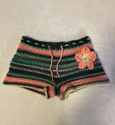 a crocheted shorts with a flower on the side