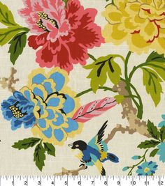 a flowered fabric with birds and flowers on it, as well as a ruler