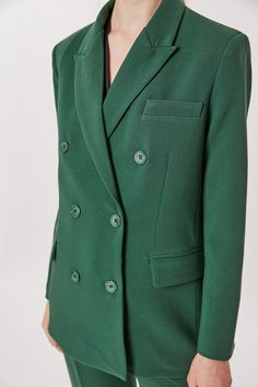 This Deluc Sophia Blazer is a stylish and sophisticated addition to your wardrobe. The double breasted blazer is crafted from a polyester-rayon blend in a bold pine green hue and features an oversized fit. The model is wearing an XS. Chic Green Notch Lapel Blazer, Elegant Green Blazer For Fall, Green Single Breasted Blazer Dress For Workwear, Green Blazer With Button Closure And Suit Collar, Spring Office Green Blazer Dress, Spring Green Office Blazer Dress, Spring Green Blazer Dress For Office, Green Long Sleeve Blazer For Office, Green Fall Blazer With Buttons