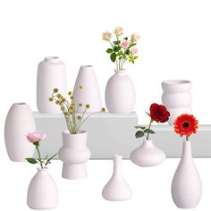 there are many white vases with flowers in them on the shelf next to each other